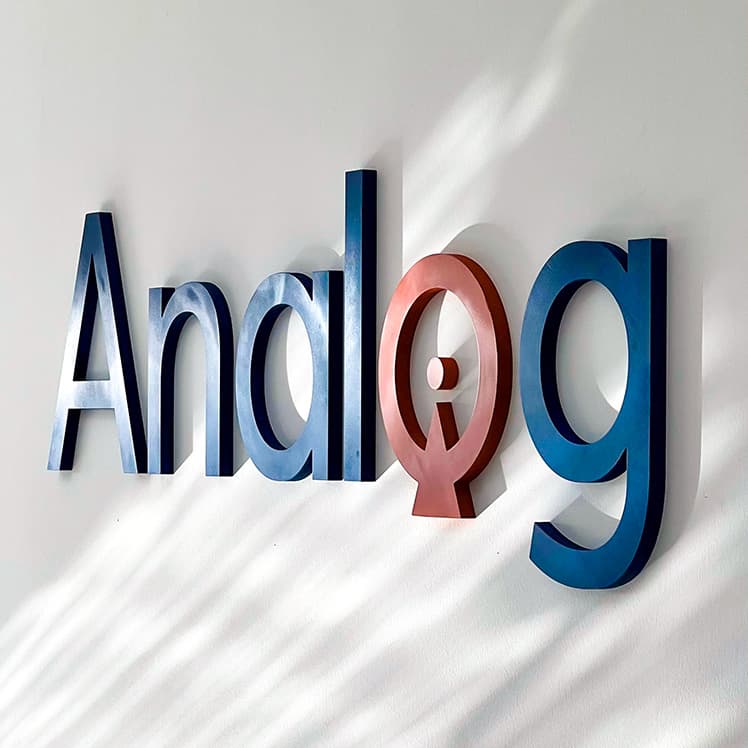 The Analog sign on the office wall in Erbil
